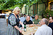 Woman serving wine in the Heuriger Mayer am Pfarrplatz, Heiligenstadt, Vienna, Austria