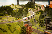 Visitors watching the model railroad, Visitors watching the largest model railroad in the world, the Miniatur Wunderland, Speicherstadt, Hamburg, Germany