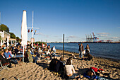 People sitting at Elbe beach, kiosk Strandperle, Oevelgoenne, Hamburg, Germany