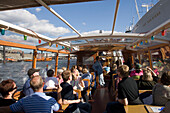 Harbour tour with a barge, People having a harbour tour with a barge at harbour, Hamburg, Germany