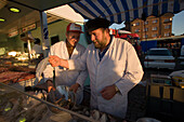 Two fish sellers at Fischmarkt, Two fish sellers at Sankt Pauli Fischmarkt, Hamburg, Germany
