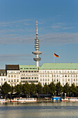 Raffles Hotel Vier Jahreszeiten and television tower, View over the Inner Alster Lake to the Raffles Hotel Vier Jahreszeiten at Neuer Jungfernstieg with Television Tower Heinrich-Hertz, the highest building of Hamburg, in background, Hamburg, Germany