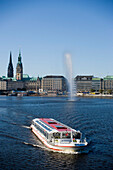 Liner on Inner Alster Lake, View over excursion boat on Inner Alster Lake Binnenalster, to Jungfernstieg with guildhall, Hamburg, Germany