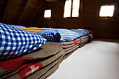 Woolen blankets in a dormatory. Cluozza hut, Cluozza Valley, Val Cluozza, Swiss Nationalpark, Engadin, Graubuenden, Grisons, Switzerland, Alps