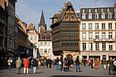 Place de la Cathedrale and Maison Kammerzell, View over the busy Place de la Cathedrale Cathedral Square, to one of the oldest and loveliest timbered houses the Maison Kammerzell, Strasbourg, Alsace, France