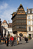 Place de la Cathedrale and Maison Kammerzell, View over the busy Place de la Cathedrale Cathedral Square, to one of the oldest and loveliest timbered houses the Maison Kammerzell, Strasbourg, Alsace, France
