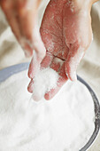 Hands with salt for bodypeeling