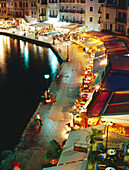 Illuminated Venetian Harbour at night with restaurants, Chania, Crete, Greece