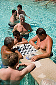 Men playing chess in a thermal bath, Men playing chess in a thermal bath of the Szechenyi-baths, Pest, Budapest, Hungary