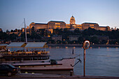 Restaurant Ship on Danube and Royal Palace, View over a restaurant ship on Danube to the illuminated Royal Palace on Castle Hill, Buda, Budapest, Hungary