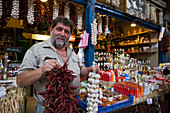 Seller offering products, Seller offering products, Central Market Hall, Pest, Budapest, Hungray