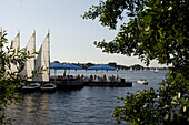 Cafe on jetty, sailing boats on lake Aussenalster, river Alster, Hamburg, Germany