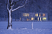 House in rural winter landscape, night, Fischerhude, Lower Saxony, Germany