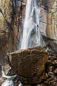 Canyoning, Man abseiling through a waterfall, Corsica Raid, Piscia di Gallu, Ospedale, Corsica, Mediterranean, France