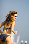 Young woman wearing bikini at beach