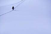 One snowboarder walking over snowcovered mountain, Kuehtai, Tyrol, Austria