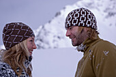 Young couple standing close together, in winter scenery, Kuehtai, Tyrol, Austria