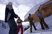 Young people having fun with snowball fight, Kuehtai, Tyrol, Austria