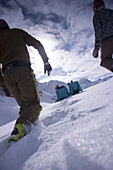 Two young people relaxing on lounge chairs, two others walking to them, Kuehtai, Tyrol, Austria