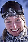 Young woman wearing ski googles, portrait, Kuehtai, Tyrol, Austria