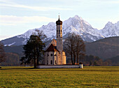 Church of St. Kolomann in front of mountains near Fuessen, Upper Bavaria, Germany