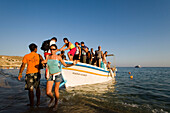 People leaving boat at beach, Paradise Beach, Mykonos, Greece