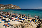 View to the Elia Beach with a lot of sunshades and bathers, Elia, Mykonos, Greece