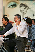 mobile phone,Mobilfunk, Handy, Telefon, chinesisch, man on bike with mobile phone, Fahrradfahrer