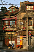 Hongkou quarter Shanghai, street corner, street sweeper, morning light, traffic sign, cars prohibited