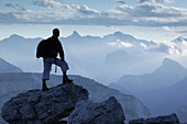 Hiker looking at mountains, Cristallo Group,  Dolomites ,Veneto, Italy