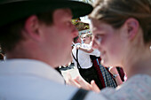 Couples in traditional bavarian clothes at celebration of 1st May, Muensing, Bavaria, Germany