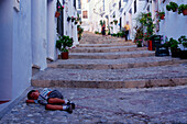 Child sleeping in an alley in Frigliana,white village,Province Malaga,Andalusia,Spain
