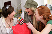 Young women with shopping bags