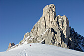 Person hiking through snow, Gruppo della Marmolada, Dolomites, Italy