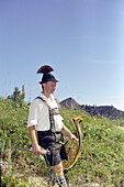 Musician with Tuba, procession, Schachen, Bavaria, Germany