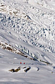 Two people at the slope on Fee Glacier near Längfluh, Saas-Fee, Valais, Switzerland (2869 metres above sea level)