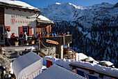 People sitting on terrace of Restaurant Paradies (2540 m), Findeln, Zermatt, Valais, Switzerland