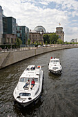 Connoisseur Houseboats Cruising Past Reichstag Parliament Building,River Spree, Berlin, Germany