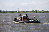 Historic Tugboat Houseboat,Noorder Oudeweg Waterway, near Joure, Frisian Lake District, Netherlands