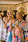 Traditional Thai dancers performing for Brahma, they dancing on request for donations, Erawan Shrine, Ratchadamri Road near Siam Square, Pathum Wan District, Bangkok, Thailand