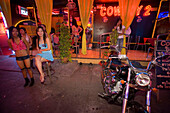 Go-go girls in front of a nightclub, Soi Cowboy, a red-light district, Th Sukhumvit, Bangkok, Thailand
