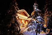 Illuminated log cabin, Alberta, Canada