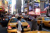 7th. Avenue, japanese tourists, family, yellow cab, traffic, Manhattan, New York City, New York, United States of America, U.S.A.
