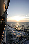 Sunset above the sea, cruise ship MS Delphin Renaissance