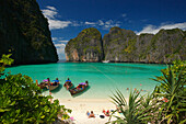 View over Maya Bay, a beautiful scenic lagoon, famous for the Hollywood film "The Beach" with sunbathing tourists and anchored boats, Ko Phi-Phi Leh, Ko Phi-Phi Islands, Krabi, Thailand, after the tsunami