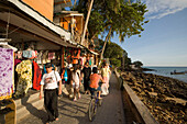 Tourists strolling over boardwalk with shops and restaurants, Ko Phi Phi Don, Ko Phi Phi Island, Krabi, Thailand, after the tsunami