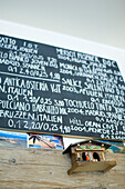 Recommendations for wine on chalkboard and cuckoo clock, Loretta Bar, Munich