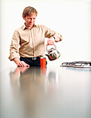 Man pouring water in glass