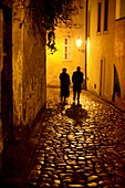 Couple walking down an alley, Mala Strana, Little Quarter, Prague, Czech Republic