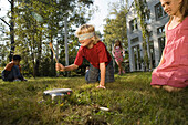 Children playing Hit the Pot, children's birthday party